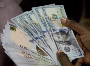 Naira exchanges at N445.38 to dollar