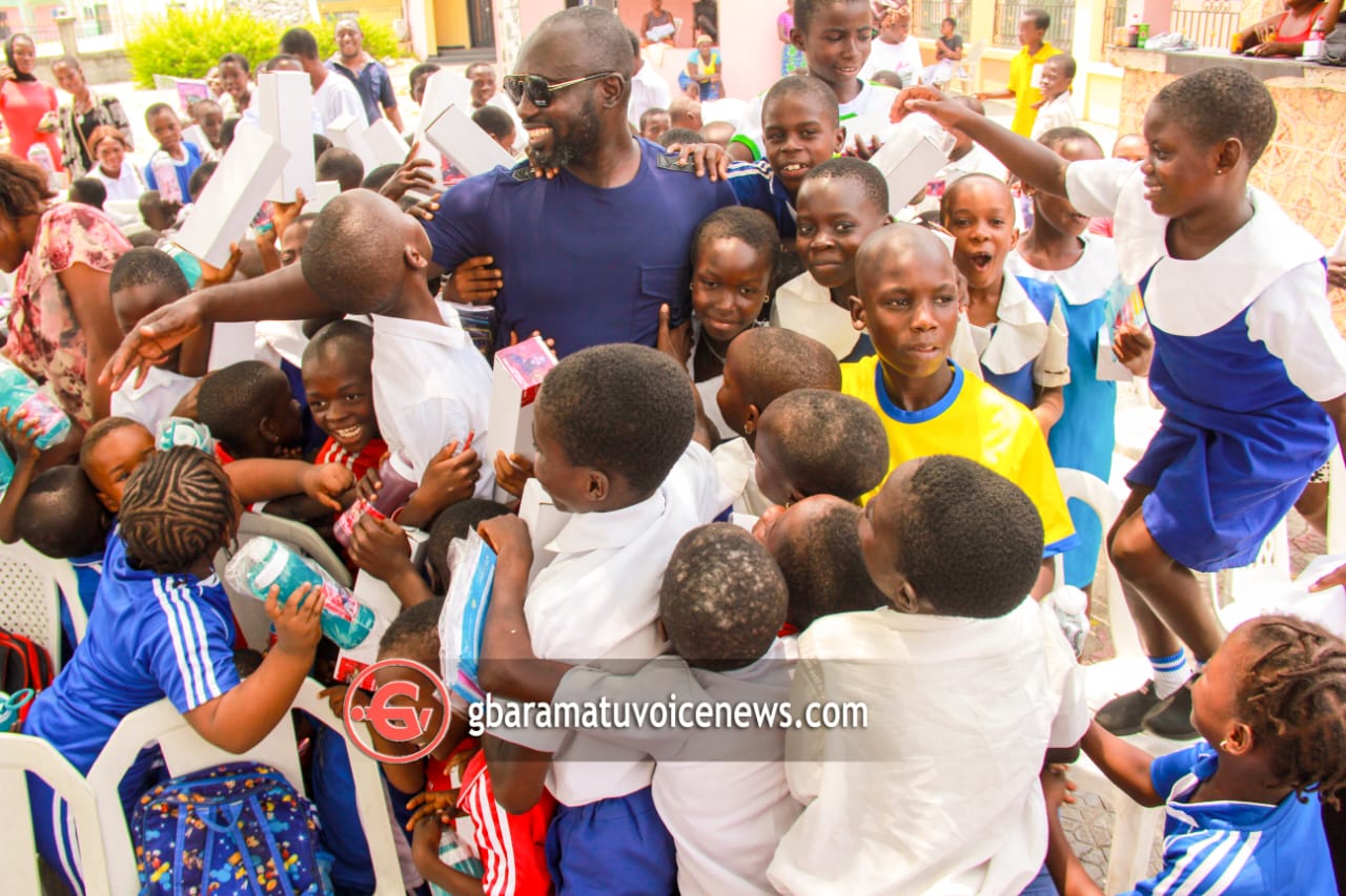 Michael Tonlagha marks birthday with children in Benikrukru, donates learning materials, clothing items, others